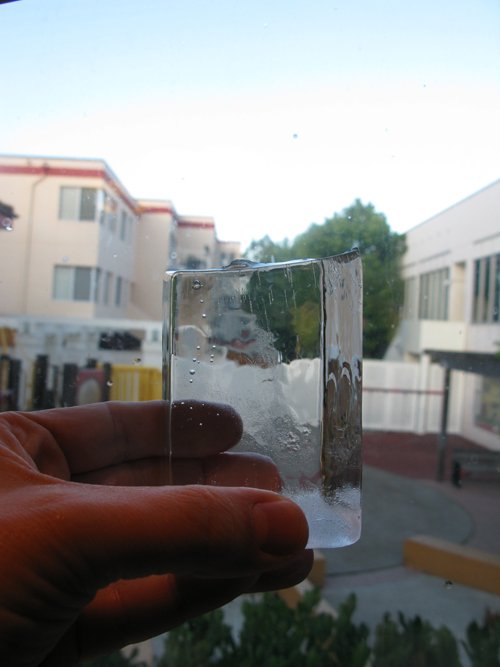 Holding ice cube small clear ice cubes