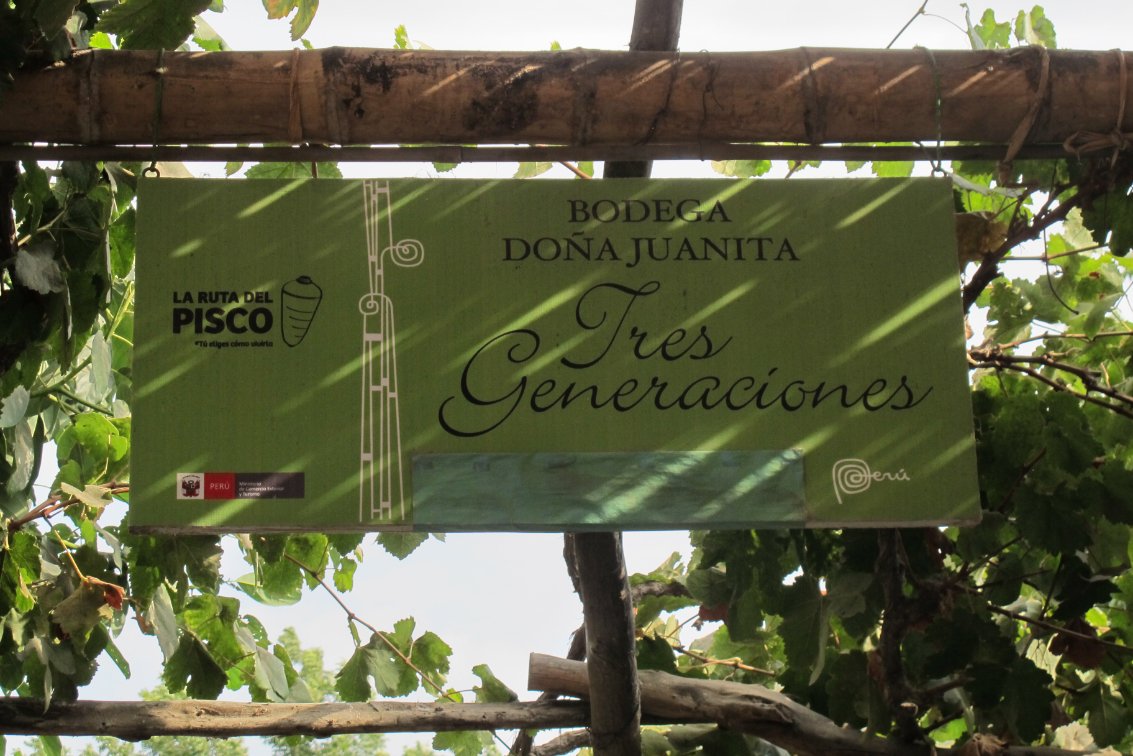 Bodega Dona Juanita Tres Generaciones Pisco Peru sign