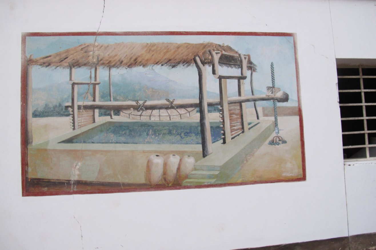 Lovera Distillery Pisco Peru painting carrying botijas